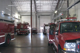 fire department interior with firetrucks